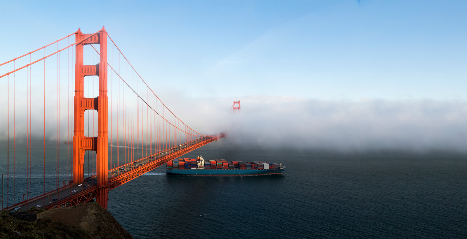 Container vessel under Golden Gate Bridge Logistic landing and child theme by Divi.Expert